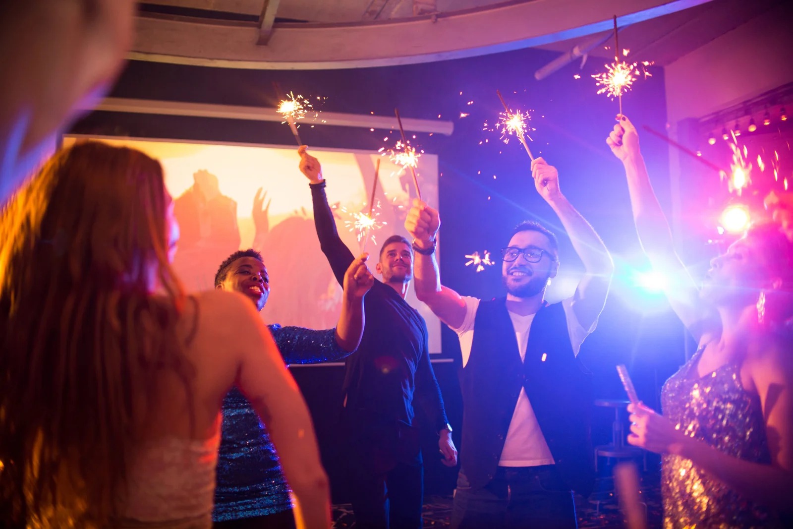 imgi_26_young-people-with-sparklers-at-awesome-party-2025-03-05-15-55-33-utc-1-scaled